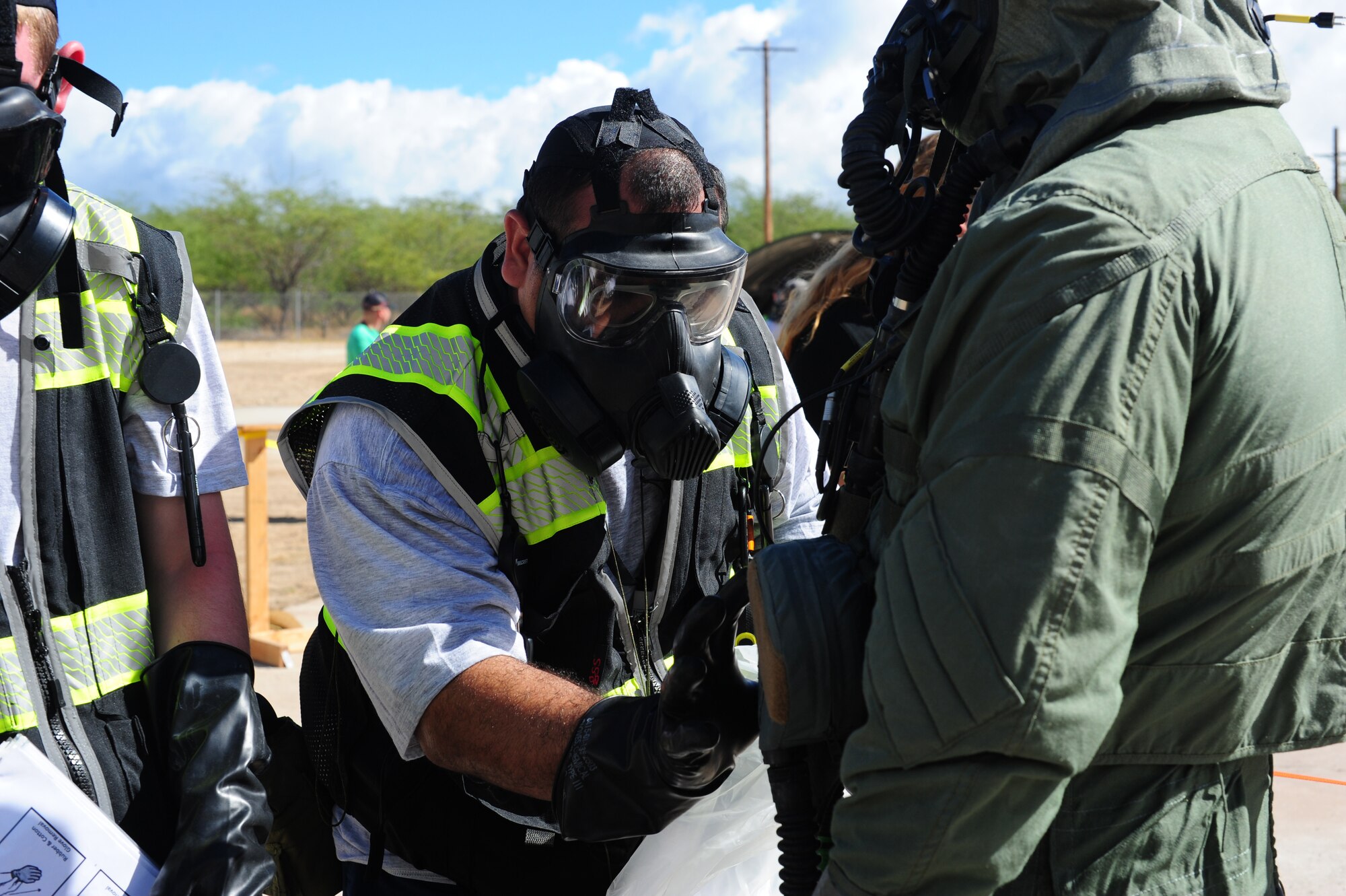 Master Sgt. Roderick Baker, 154th Operations Support Squadron F-22 Raptor aircrew flight equipment NCO, executes decontamination procedures Aug. 31, 2022, at Joint Base Pearl Harbor-Hickam, Hawaii. More than 70 U.S. Airmen and Marines participated in a Pacific Air Forces chemical warfare and decontamination exercise called Toxic Pineapple.