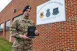 U.S. Air Force Airman 1st Class Cody Eichelberger, a defender with the 167th Security Forces Squadron, holds a copy of his book ‘Burnt Chapel’ at the 167th Airlift Wing, Martinsburg, West Virginia, Oct. 1, 2022.