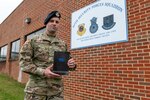 U.S. Air Force Airman 1st Class Cody Eichelberger, a defender with the 167th Security Forces Squadron, holds a copy of his book ‘Burnt Chapel’ at the 167th Airlift Wing, Martinsburg, West Virginia, Oct. 1, 2022.