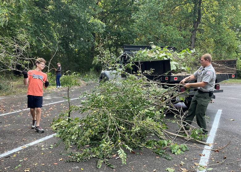 Local volunteers trimmed bushes and trees at Stark Knob Boat Ramp during National Public Lands Day at Old Hickory Lake in Hendersonville, Tennessee. Park Ranger Jakob Craig loaded brush onto a truck that took the trimmings to be properly disposed of.