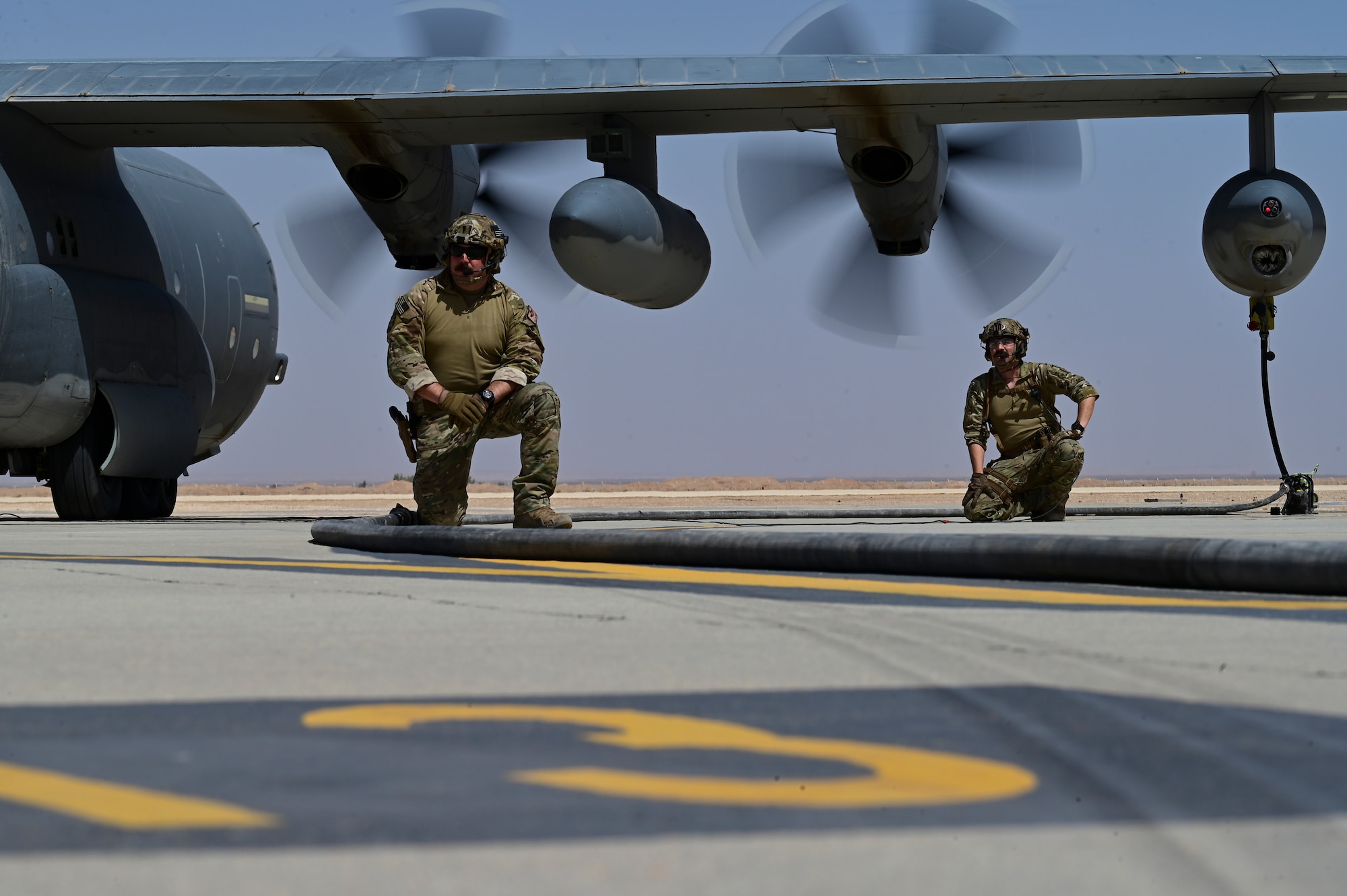 U.S Air Force members with the 332d Air Expeditionary Wing observe a refueling from a HC-130J Combat King II during a Forward Arming Refueling Point (FARP) during a training exercise designed around Agile Combat Employment, at an undisclosed location in Southwest Asia, September 27-28, 2022. FARP provides flexibility and allows aircraft to be refueled in austere locations. (U.S Photo by Staff Sgt. Ashley Sokolov)