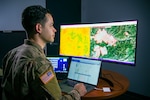 Colorado National Guard Sgt. Joseph Flores, intelligence specialist, 157th Infantry Battalion, Colorado Springs, assigned to the Task Force FireGuard team, analyzes environmental factors in a wildfire area. FireGuard facilitates early detection of wildfires in remote areas.