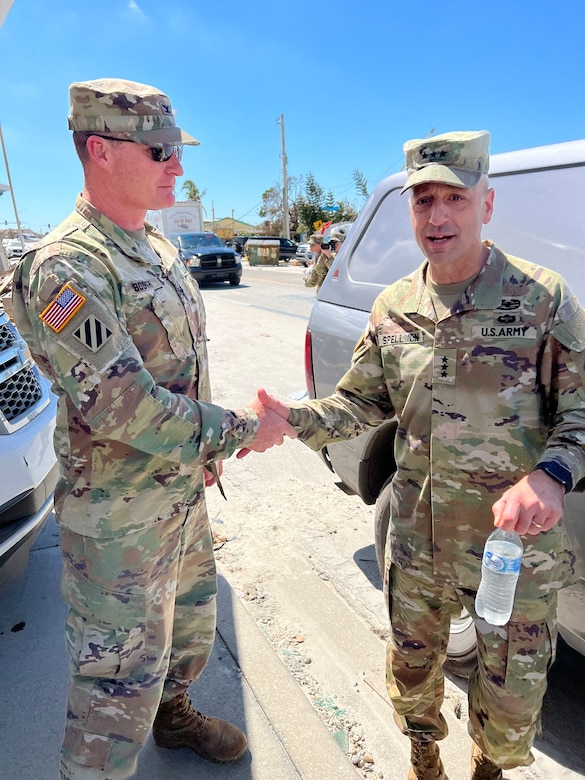 Col. James Booth, U.S. Army Corps of Engineers Jacksonville District commander, greets Lt. Gen. Scott Spellmon, commanding general of the U.S. Army Corps of Engineers and 55th chief of engineers.  Spellmon toured damaged areas of Fort Myers Beach.