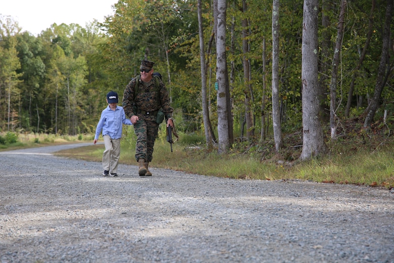 Col. Mullins was accompanied by his 8-year-old grandson, Blake, during the final mile of his 20-mile hike, representative of his expansive career in the U.S. Marine Corps. He retired from the U.S. Marine Corps after 31 years of faithful service on Sept. 29, 2022, at a ceremony at Marine Corps Base Quantico’s 395-acre Transportation Demonstration Support Area. The ceremony was officiated by Gen. Eric M. Smith, the assistant commandant of the Marine Corps, and attended by family, friends and former Marine Corps colleagues.