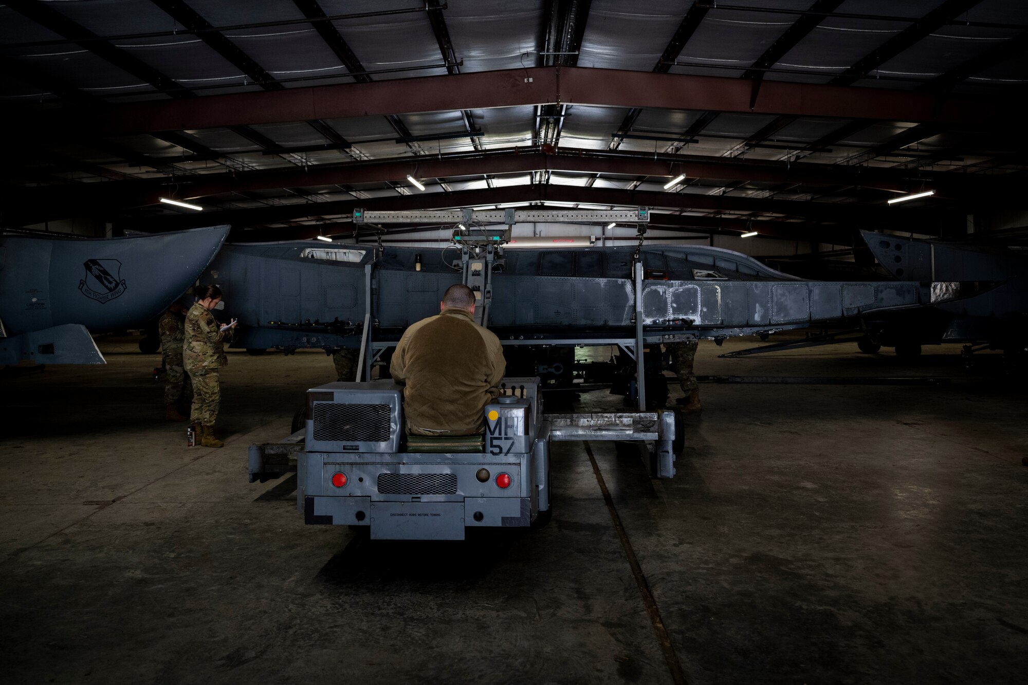 Airmen assigned to the 4th Maintenance Group mount a conformal fuel tank to a CFT stand at Seymour Johnson Air Force Base, North Carolina, Oct. 3, 2022. Multiple units within the 4th MXG contributed to planning and creating these new stands to combat the supply shortage.