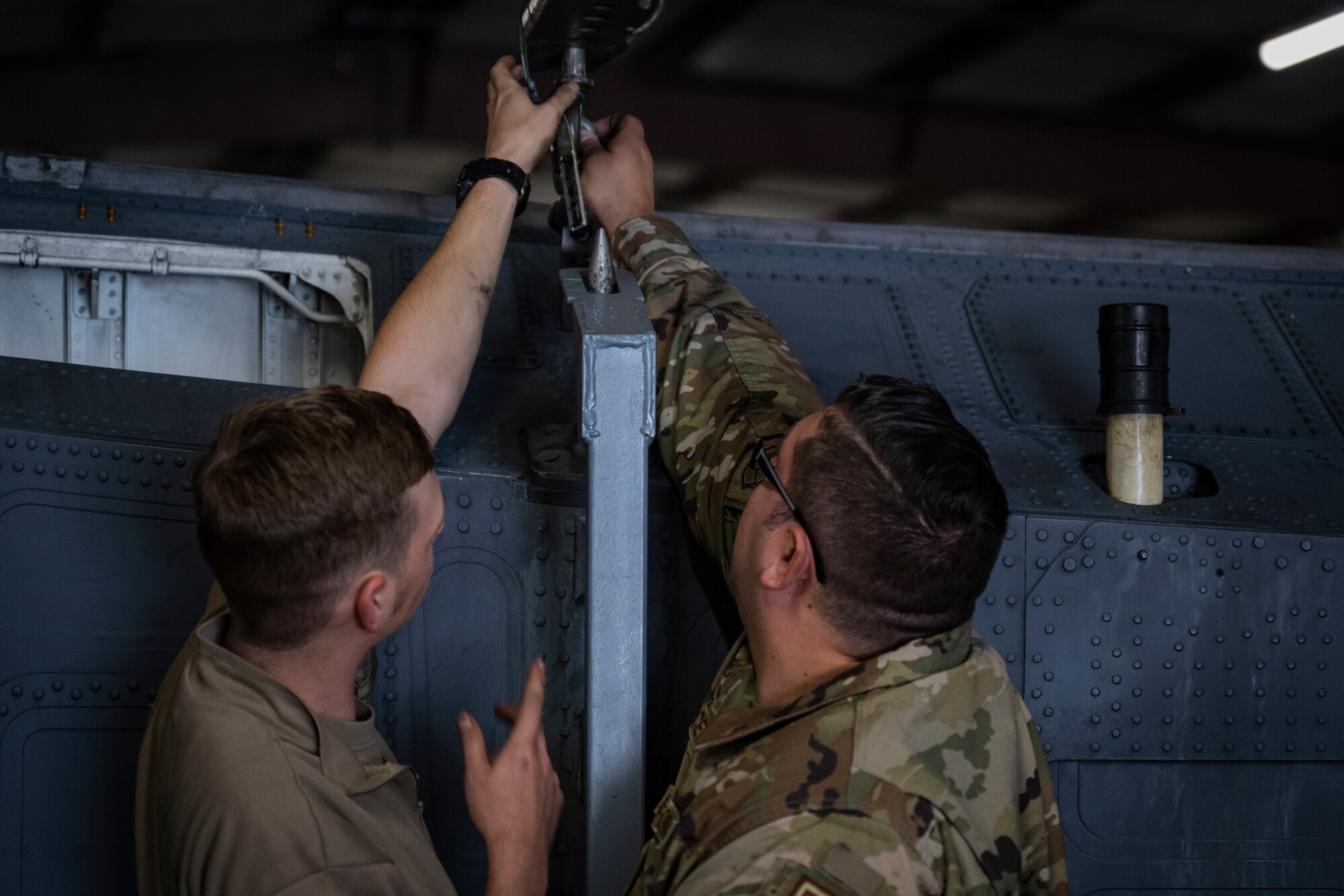 Airmen assigned to the 4th Maintenance Group put a pin in a conformal fuel tank stand at Seymour Johnson Air Force Base, North Carolina, Oct. 3, 2022. The 4th MXG designed new CFT stands to increase the supply of stands allowing them to become more efficient.