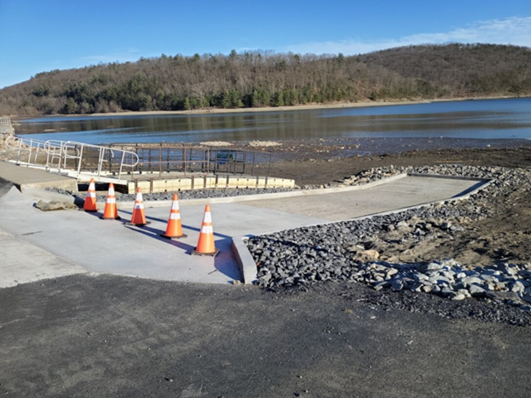 The boat ramp at Aitch is shown out of the water during the 2021 Raystown Lake drawdown. Orange traffic cones block the dried out ramp from traffic while repairs are completed.