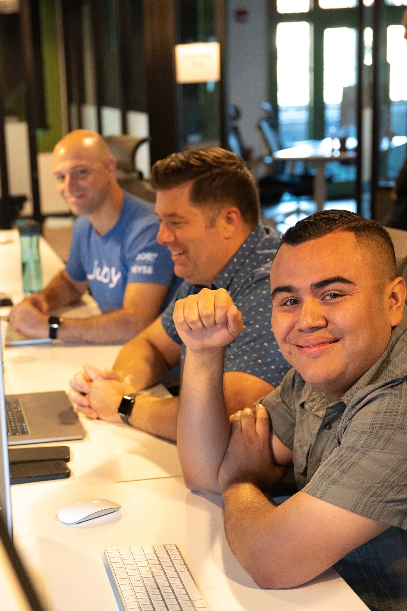 Tech. Sgt. Alex Tamayo (from right), a 162nd Wing security manager, works with Senior Master Sgt. Charles Givens, ARCWERX Public Affairs Specialist, and Capt Brett Mather, Corsair Ranch deputy chief of software, on a problem set during the recent ‘Hack the Ranch’ event in Tucson, Ariz. (U.S. Air National Guard photo by Maj. Angela Walz)