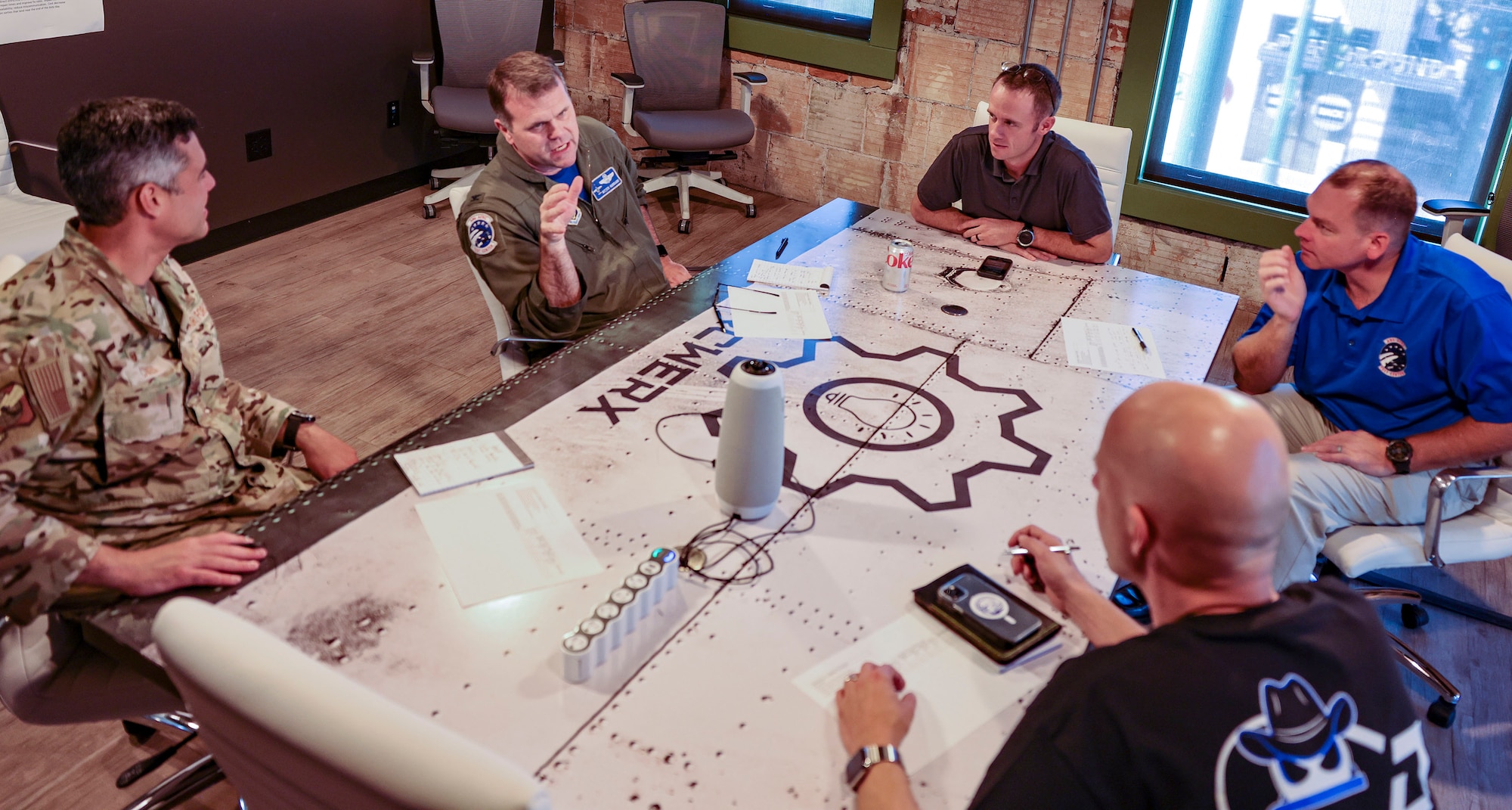 Judges representing the active-duty Air Force, Air National Guard and the Air Force Reserve deliberate on presentations given during Hack the Ranch, a hackathon hosted by Corsair Ranch, the Air Force Reserve Component’s software factory. Submissions were graded on functionality, usability, relevancy, and ability for rapid deployment. (U.S. Air National Guard photo by Senior Master Sgt. Charles Givens)