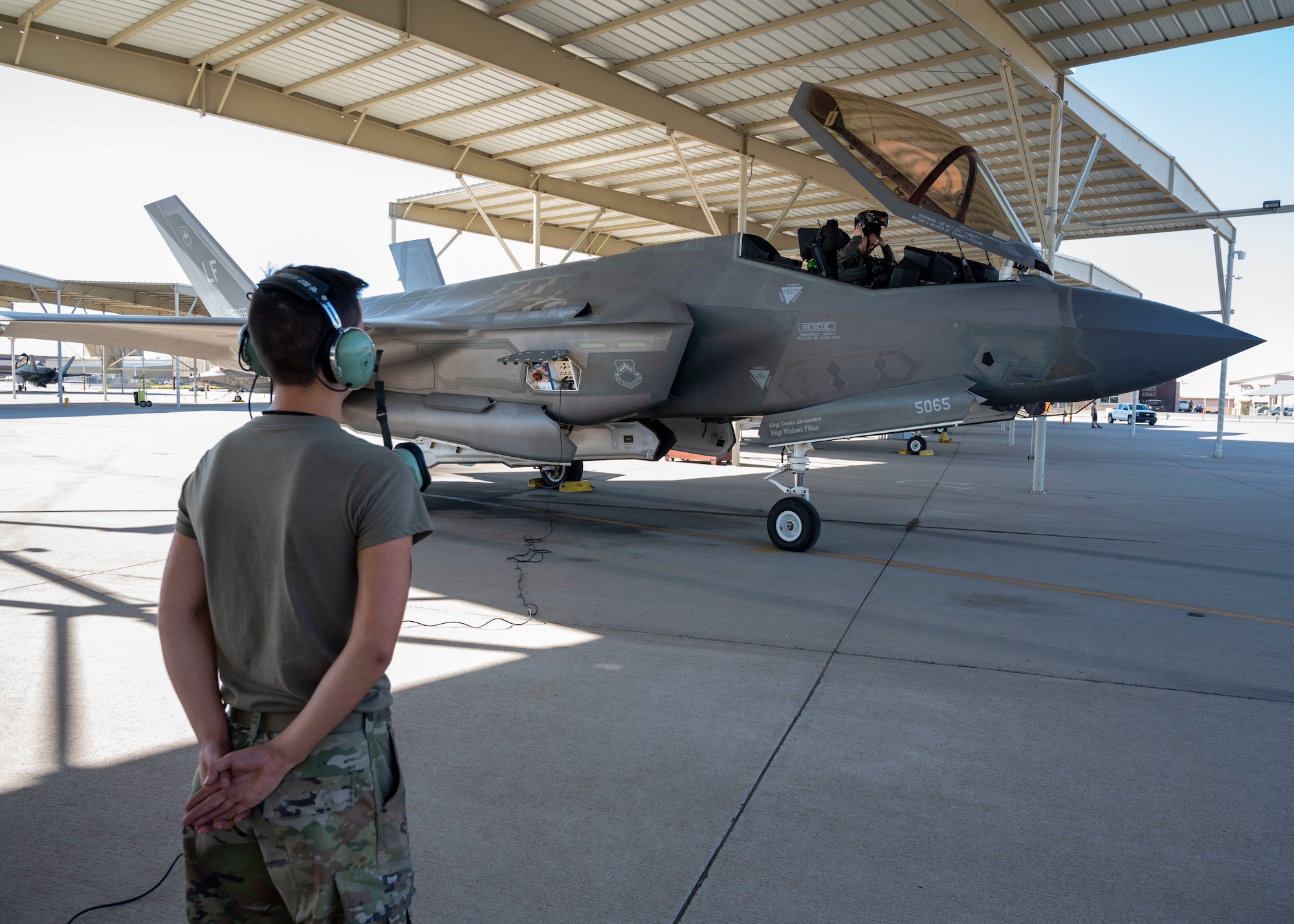 U.S. Air Force Airman 1st Class Joseph Sullivan, 62nd Aircraft Maintenance Unit crew chief, oversees the successful preparation of an F-35A Lightning II for flight Oct. 3, 2022, at Luke Air Force Base, Arizona.