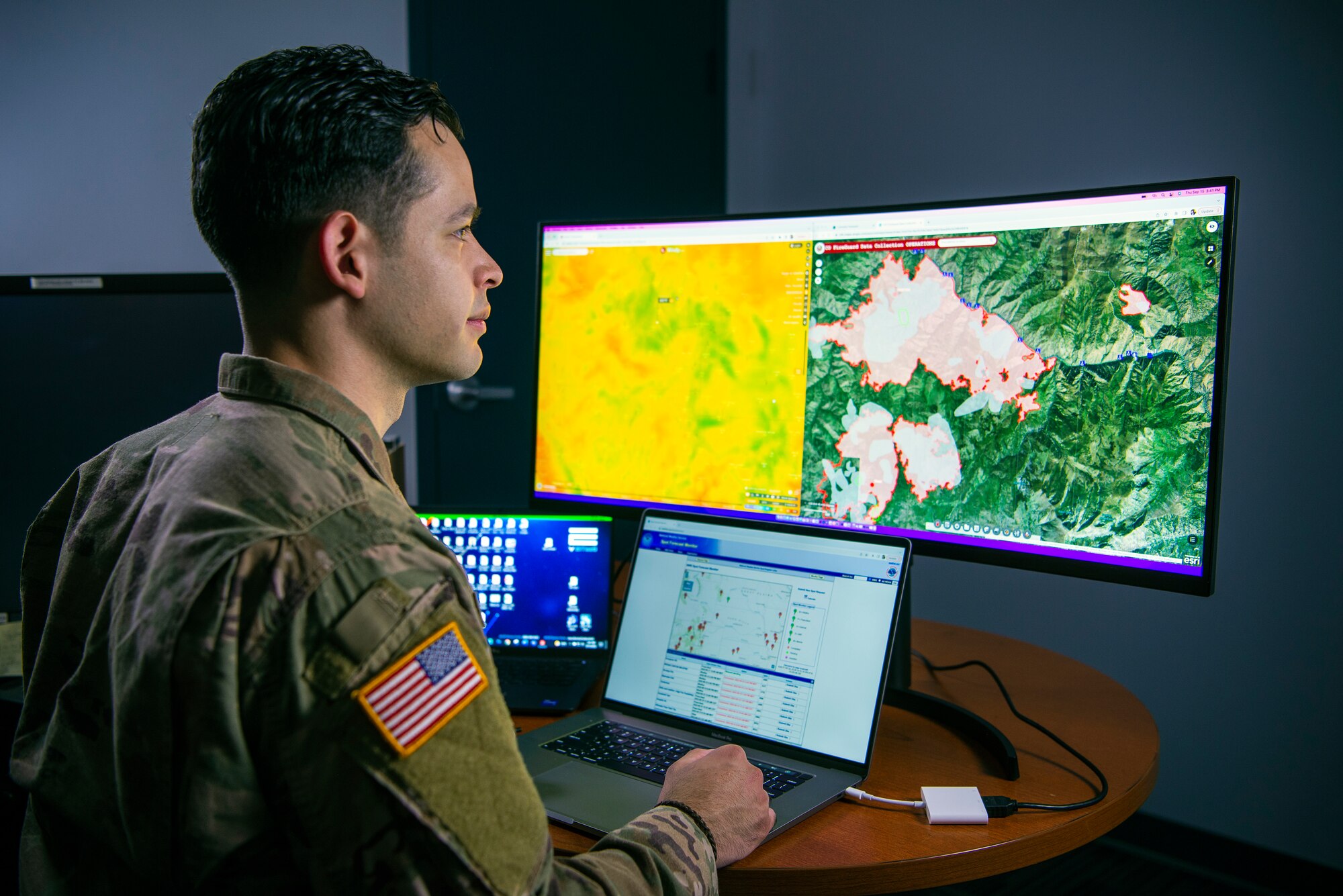 Colorado National Guard Sgt. Joseph Flores, intelligence specialist, 157th Infantry Battalion, Colorado Springs, assigned to the Task Force FireGuard team, analyzes environmental factors in a wildfire area. FireGuard facilitates early detection of wildfires in remote areas.