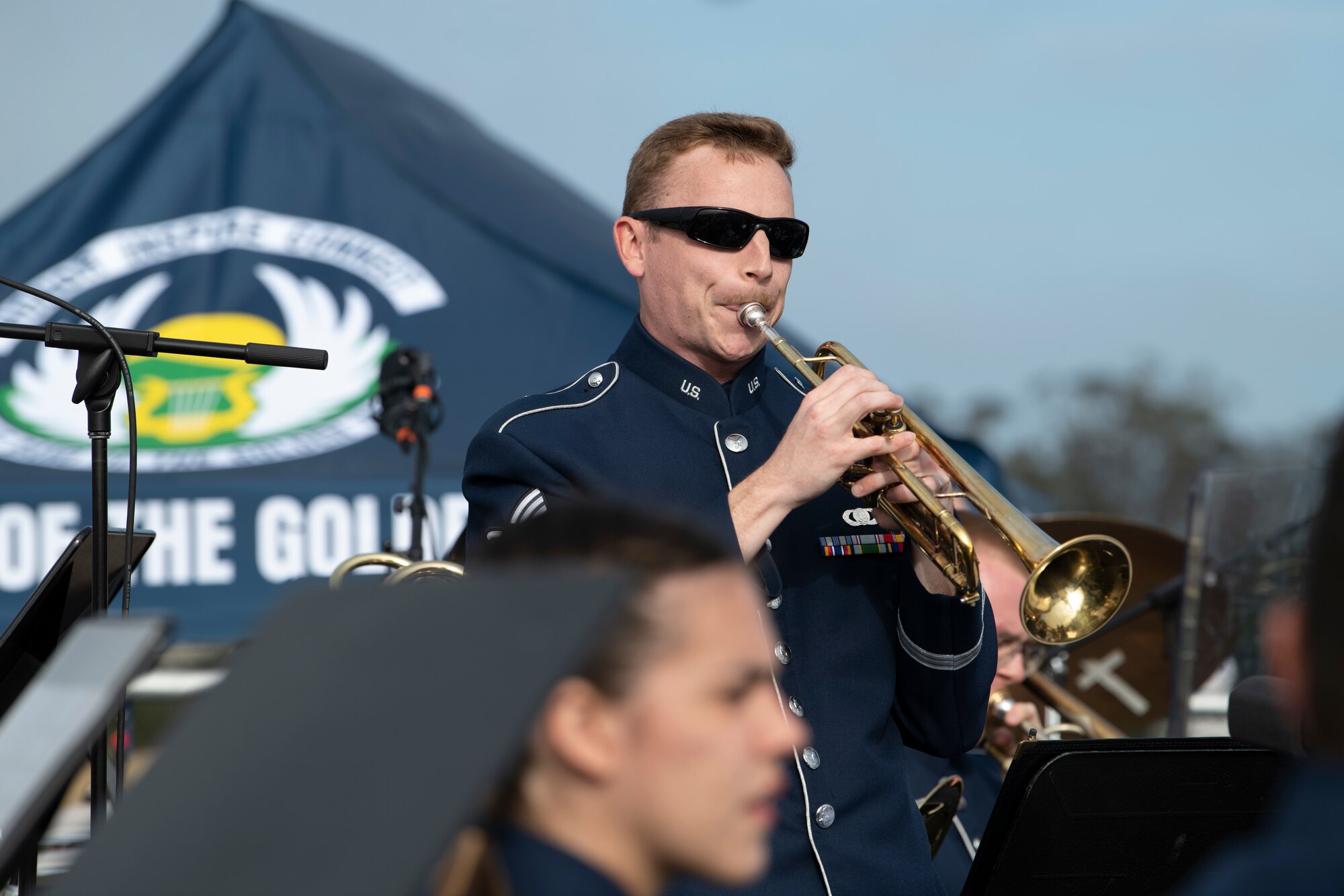 Airman plays the trumpet.