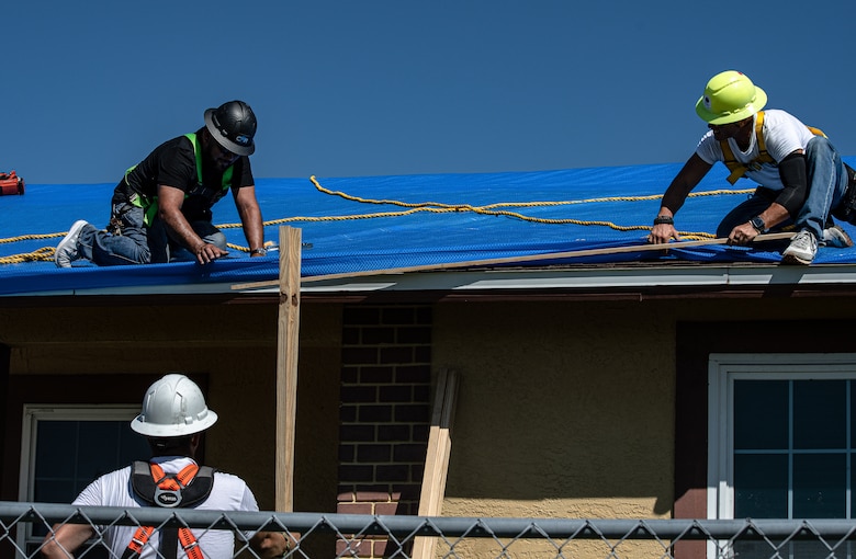 Saturday, Oct 8, 2022, the first Blue Roof install in Ft Myers, Florida. Roofer Jonathan Whitaker removes D Ring. 
Operation Blue Roof is designed to protect property, reduces temporary housing costs, and allows residents to remain in their homes while recovering from the storm.
A resident begins by submitting a Right of Entry (ROE) request through the blueroof.us website or calling 888-ROOF-BLU (888-766-3258). (USACE photo by Bri Sanchez)