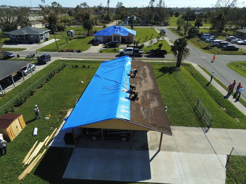 Saturday, Oct. 9, 2022, the U.S. Army Corps of Engineer installed its first Blue Roof in Fort Myers Florida.  Operation Blue Roof is a priority mission managed by the U.S. Army Corps of Engineers (USACE) for FEMA. The goal of the Blue Roof program is to provide homeowners in disaster areas with fiber-reinforced, industrial-strength sheeting to protect storm-damaged roofs until homeowners can make permanent repairs. This program is a NO COST service for homeowners. Operation Blue Roof is designed to protect property, reduces temporary housing costs, and allows residents to remain in their homes while recovering from the storm. (USACE photo by Thomas Spencer)