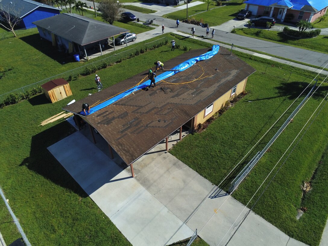 Saturday, Oct. 9, 2022, the U.S. Army Corps of Engineer installed its first Blue Roof in Fort Myers Florida.  Operation Blue Roof is a priority mission managed by the U.S. Army Corps of Engineers (USACE) for FEMA. The goal of the Blue Roof program is to provide homeowners in disaster areas with fiber-reinforced, industrial-strength sheeting to protect storm-damaged roofs until homeowners can make permanent repairs. This program is a NO COST service for homeowners. Operation Blue Roof is designed to protect property, reduces temporary housing costs, and allows residents to remain in their homes while recovering from the storm. (USACE photo by Thomas Spencer)