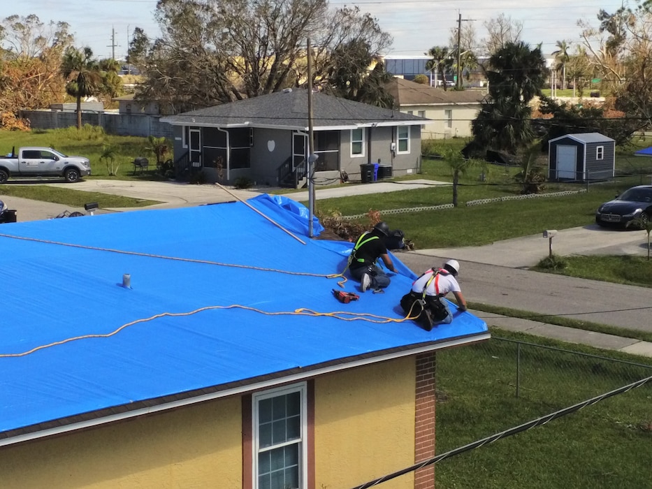 Saturday, Oct. 9, 2022, the U.S. Army Corps of Engineer installed its first Blue Roof in Fort Myers Florida.  Operation Blue Roof is a priority mission managed by the U.S. Army Corps of Engineers (USACE) for FEMA. The goal of the Blue Roof program is to provide homeowners in disaster areas with fiber-reinforced, industrial-strength sheeting to protect storm-damaged roofs until homeowners can make permanent repairs. This program is a NO COST service for homeowners. Operation Blue Roof is designed to protect property, reduces temporary housing costs, and allows residents to remain in their homes while recovering from the storm. (USACE photo by Thomas Spencer)