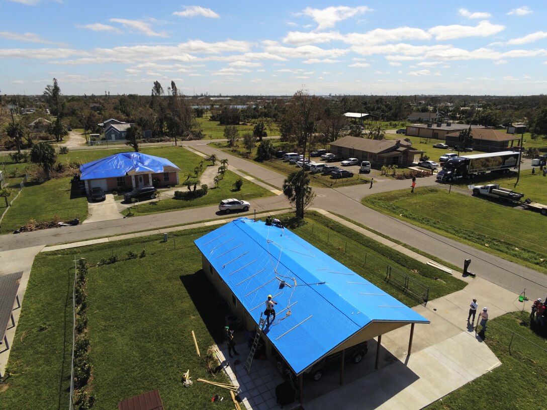 Saturday, Oct. 9, 2022, the U.S. Army Corps of Engineer installed its first Blue Roof in Fort Myers Florida.  Operation Blue Roof is a priority mission managed by the U.S. Army Corps of Engineers (USACE) for FEMA. The goal of the Blue Roof program is to provide homeowners in disaster areas with fiber-reinforced, industrial-strength sheeting to protect storm-damaged roofs until homeowners can make permanent repairs. This program is a NO COST service for homeowners. Operation Blue Roof is designed to protect property, reduces temporary housing costs, and allows residents to remain in their homes while recovering from the storm. (USACE photo by Thomas Spencer)