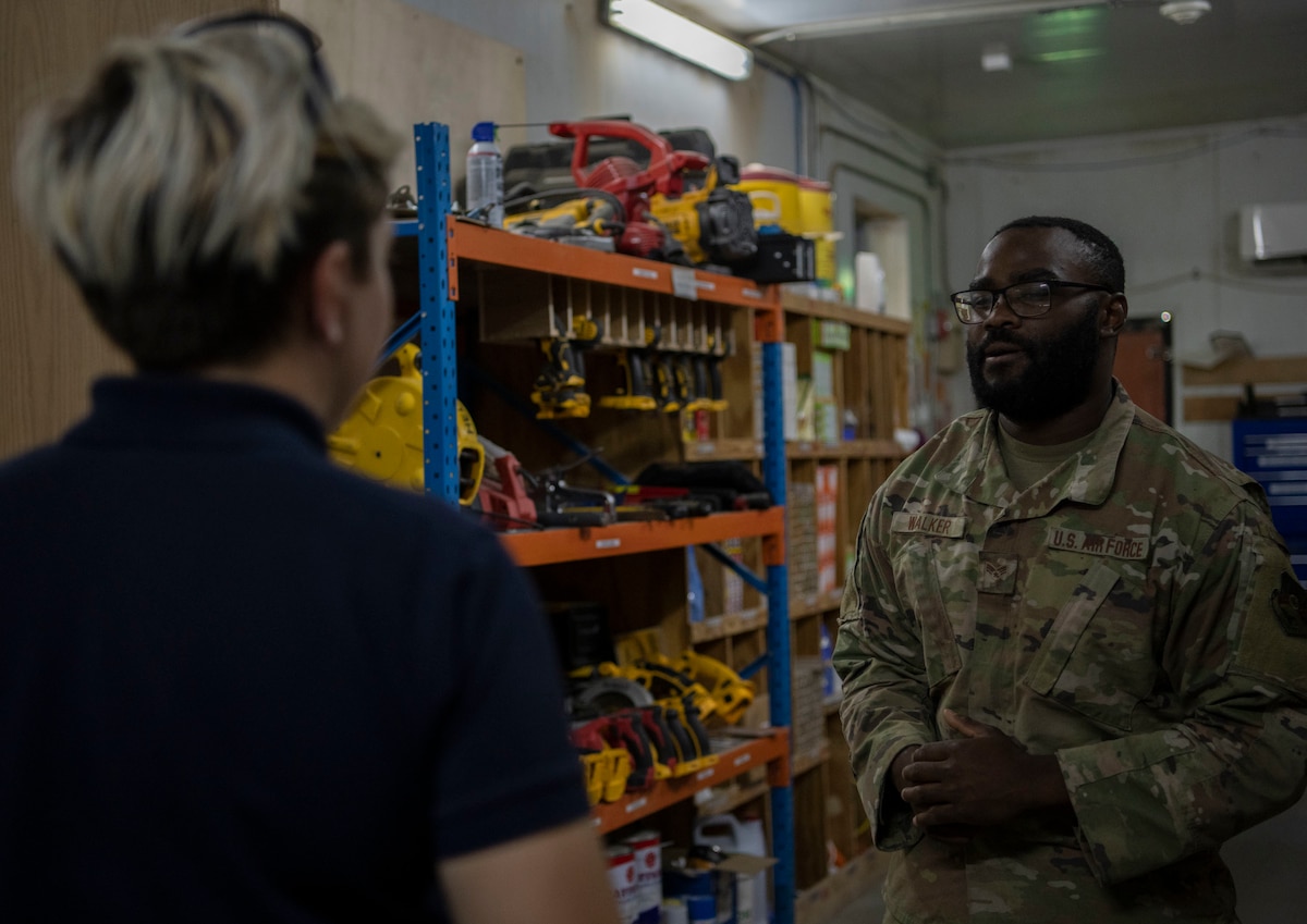 U.S. Air Force Senior Airman Cameron Walker, 386th Expeditionary Civil Engineer Squadron inventory technician, helps a customer at the U-Fix It building on Ali Al Salem Air Base, Kuwait, September 15, 2022. The U-Fix It store supplies Airmen with anything they may need for self help projects around base. (U.S. Air Force photo by Staff Sgt. Ashley N. Mikaio)