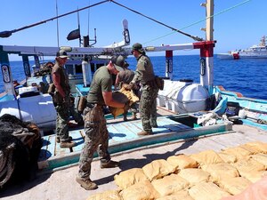 221010-G-NO146-1001 GULF OF OMAN (Oct. 10, 2022) Personnel from U.S. Coast Guard fast response cutter USCGC Glen Harris (WPC 1144) inventory illicit drugs seized from a fishing vessel in international waters in the Gulf of Oman, Oct. 10.