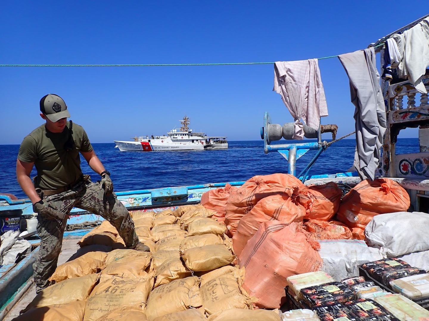 221010-G-NO146-1002 GULF OF OMAN (Oct. 10, 2022) Personnel from U.S. Coast Guard fast response cutter USCGC Glen Harris (WPC 1144) inventory illicit drugs seized from a fishing vessel in international waters in the Gulf of Oman, Oct. 10.