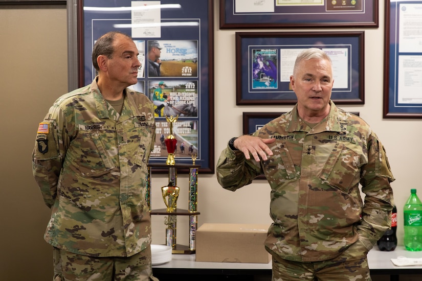 Chief Warrant Officer Charles Harris (left) listens to Army Maj. Gen. Haldane Lamberton, Kentucky National Guard adjutant general, speak at his retirement lunch on Boone National Guard Center in Frankfort, Ky. on Sept. 30, 2022. Harris is retiring after 39 years of military service as a military intelligence officer. (U.S. Army photo by Andy Dickson)