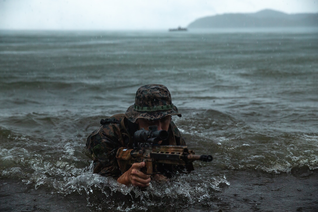 U.S. Marine Corps Cpl. Jacob Konefsky, a rifleman with 1st Battalion, 2nd Marines, conducts reconnaissance for a combined amphibious raid with Philippine Marines during KAMANDAG 6, in San Vicente, Philippines, Oct. 10, 2022. KAMANDAG is an annual bilateral exercise between the Armed Forces of the Philippines and U.S. military, designed to strengthen interoperability, capabilities, trust, and cooperation built over decades of shared experiences. 1/2 is forward deployed under 4th Marines, 3rd Marine Division as part of the Unit Deployment Program. Konefsky is a native of Chambersburg, Pennsylvania.