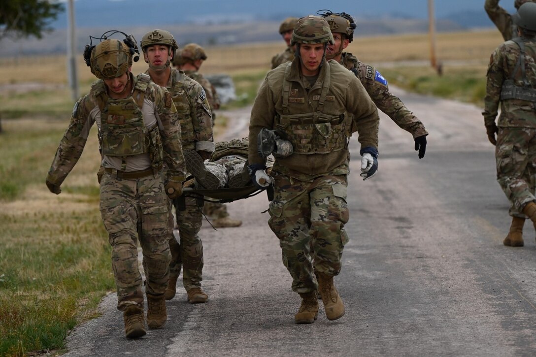 U.S. Air Force Airmen assigned to the 28th Civil Engineer Squadron participate in a litter carry exercise during the Prime Base Engineer Emergency Force, also referred to as BEEF, Challenge at Ellsworth Air Force Base, S.D. Sept. 22, 2022.