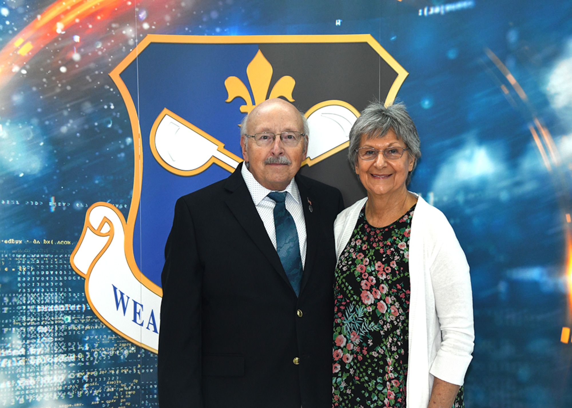 Paul Zamiska and his wife, Jeanne, take a moment to greet guests in the atrium of the 557th Weather Wing on Offutt Air Force Base, Nebraska before his 50 year retirement from the U.S. Air Force Sept. 30.