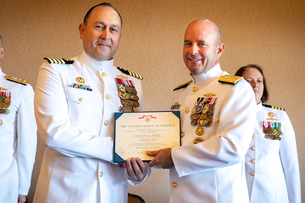NAVAL STATION MAYPORT, Fla. (Oct. 7, 2022) - Vice Adm. Jim Kilby, commander, Task Force 80 and deputy commander, U.S. Fleet Forces, presents the Legion of Merit to Capt. Ken Anderson, Commander, Navy Surface Squadron (CNSS) 14. Vice Adm. Kilby served as guest speaker at the CNSS 14 change of command and retirement ceremony for Capt. Anderson. (U.S. Navy photo by Mass Communication Specialist 2nd Class Juel Foster)