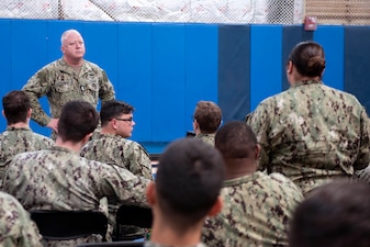 Master Chief Petty Officer of the Navy James Honea listens to a Sailor ask a question during an all-hands call at the Naval Base Point Loma, Oct. 7, 2022.