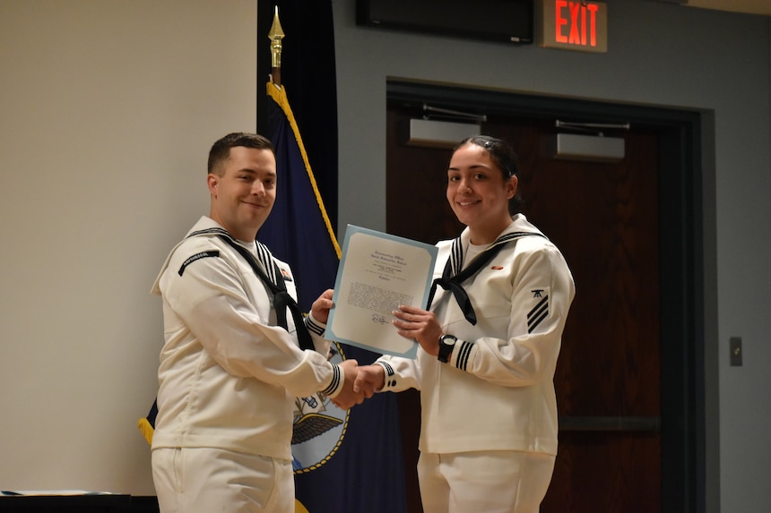 GROTON, Conn. (Sept. 16, 2022) U.S. Navy FNFT Casey Lopez receives the award for Distinguished Honor Graduate during the U.S. Naval Submarine School Fire Control Technician gradation ceremony, Sept. 16, 2022. During the ceremony, Lopez was also given her certificate of completion for finishing the U.S. Naval Submarine School Fire Control Technician ‘A’ School. (U.S. Navy photo by Lauren Laughlin)