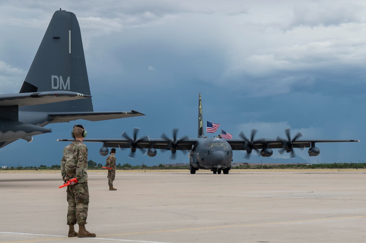 A photo of a plane taxing down the flightline