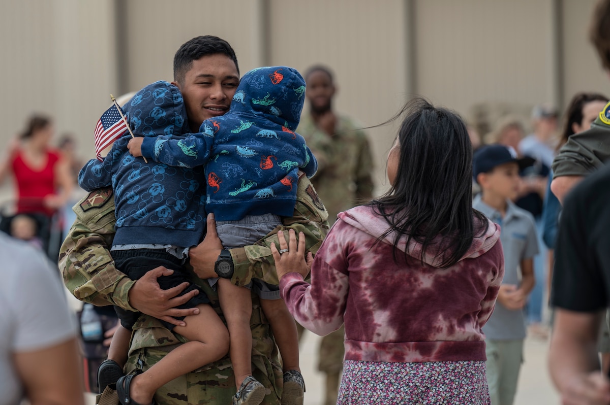 A photo of family members greeting Airmen