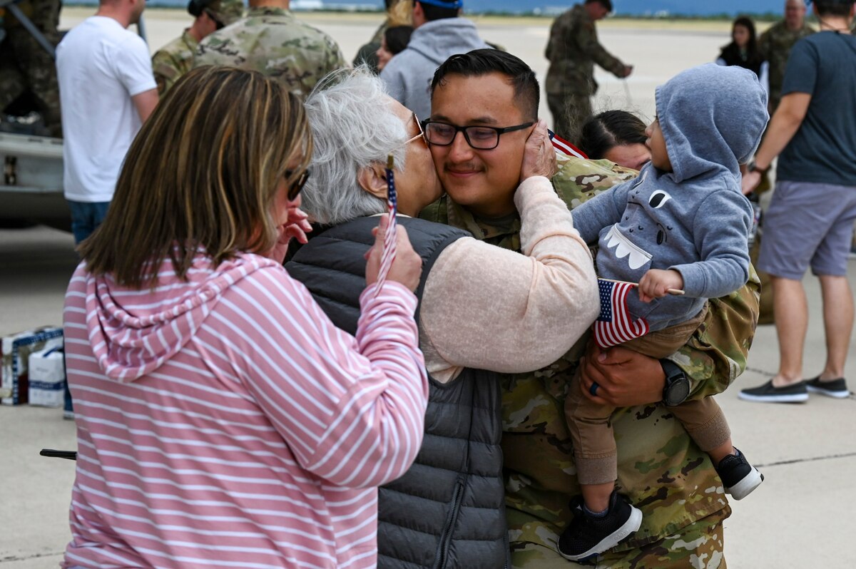 A photo of Airmen greeting family
