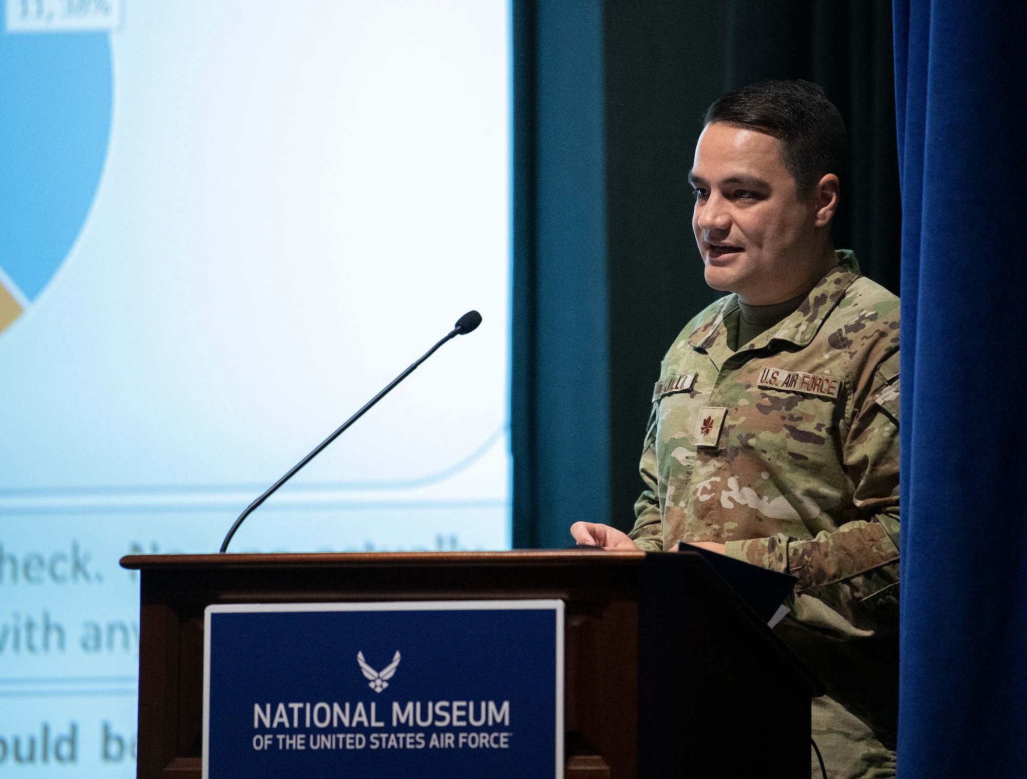 Program graduated presents his team's capstone to a panel of judges and classmates.