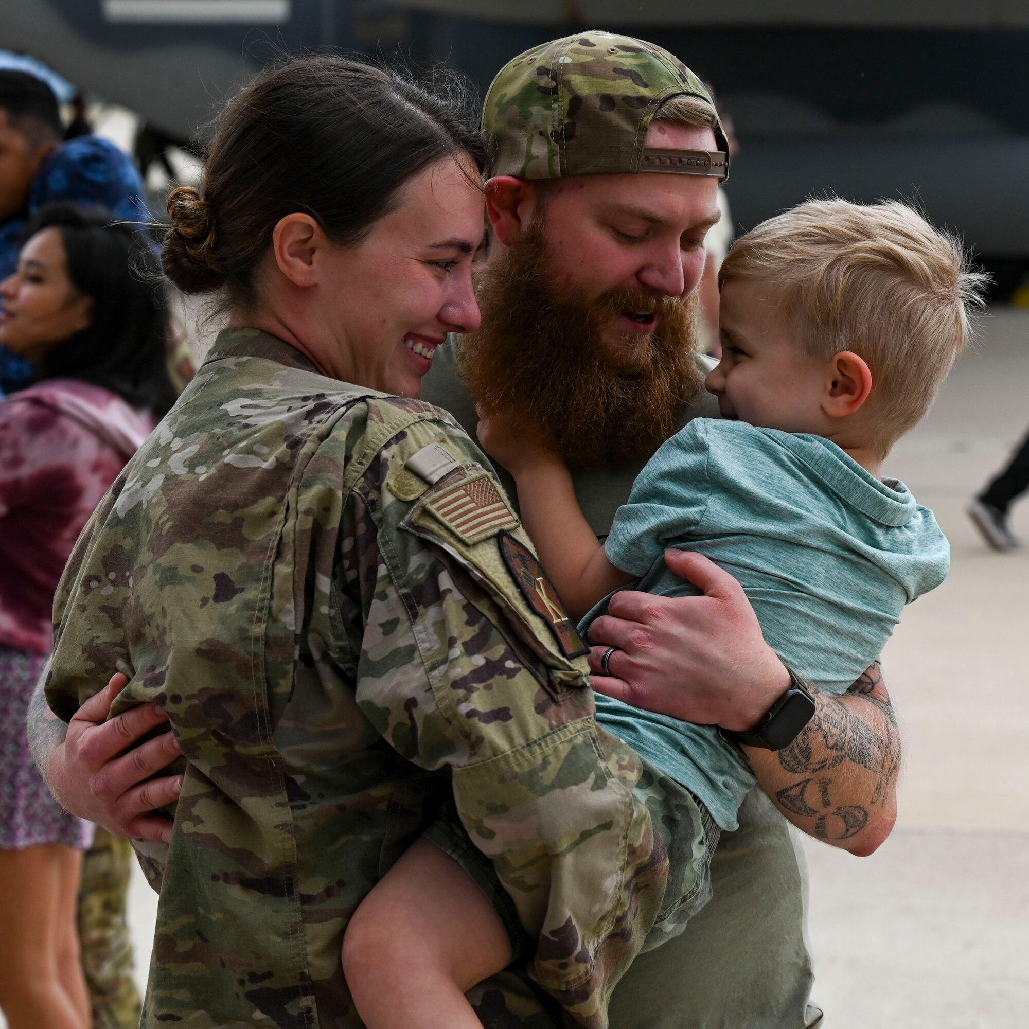 A photo of Airmen greeting family