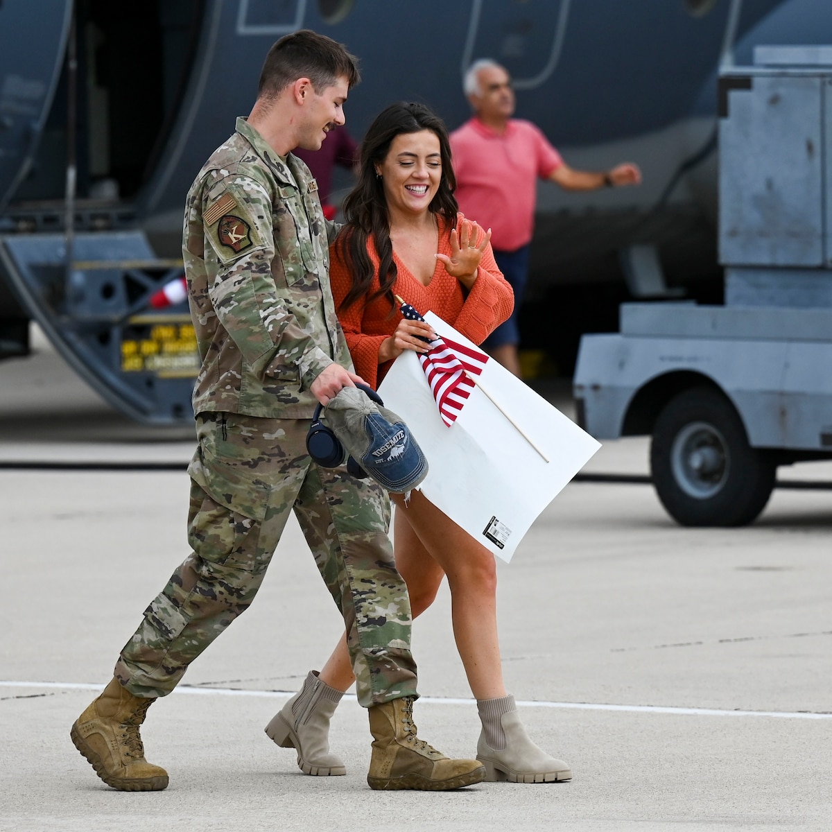 A photo of Airmen greeting family