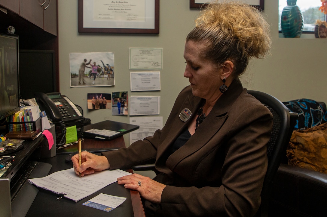 Mary Jo Betyak-Eisler, supervisor of the Community Counseling Program on Marine Corps Base Quantico, completes virtual team meetings in Cox Hall on Marine Corps Base Quantico, Virginia, Oct. 3, 2022. Betyak-Eisler has worked for Marine Corps Community Services for nine years as a counselor and as a supervisor. (U.S. Marine Corps Photo by Lance Cpl. George Nudo)