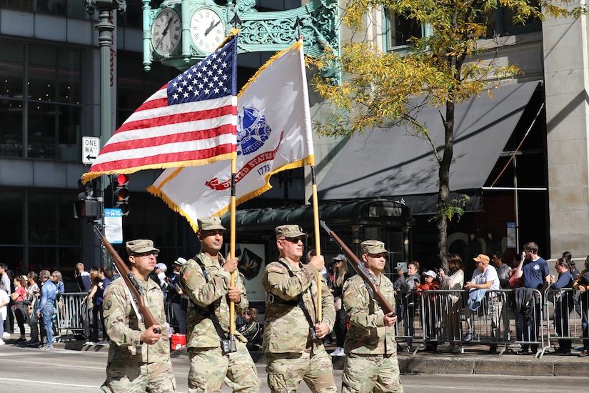 A color guard from the 85th U.S. Army Reserve Support Command, Arlington Heights, Illinois march down State Street during the 70th Annual Columbus Day Parade in Chicago on Monday, October 10, 2022.