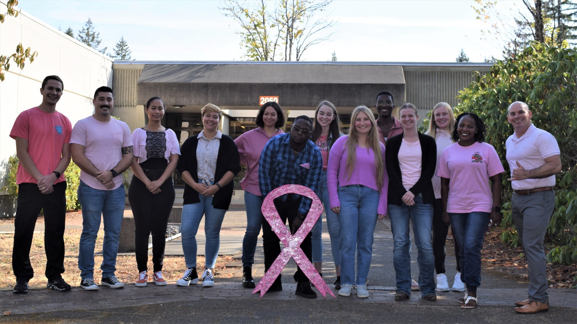 Pink ribbons fly high for breast cancer awareness as VA supports detection  and care - VA News