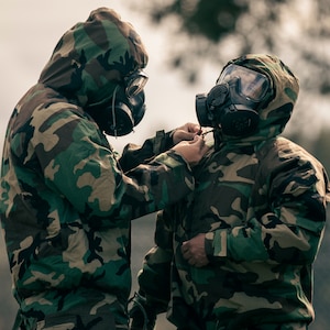 U.S. Army Soldiers with 153rd Medical Detachment (Blood Support), 56th Multifunctional Medical Battalion, 62nd Medical Brigade, don advanced chemical protective garments during an introductory course on chemical, biological, radiological and nuclear responder basics on Joint Base Lewis-McChord, Wash., Sept. 23, 2022. The two-day course was taught by decontamination subject matter experts with the Washington National Guard’s 10th Homeland Response Force.