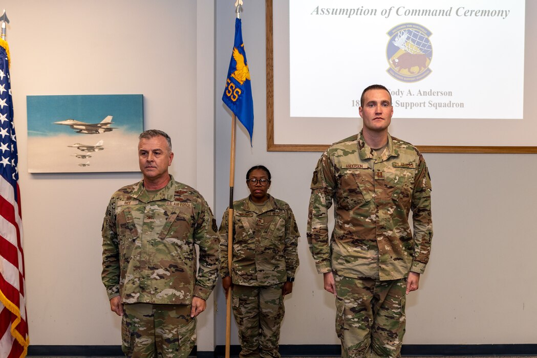 Airmen standing at attention.