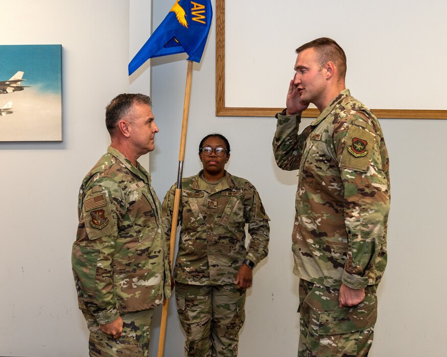 Airman saluting.