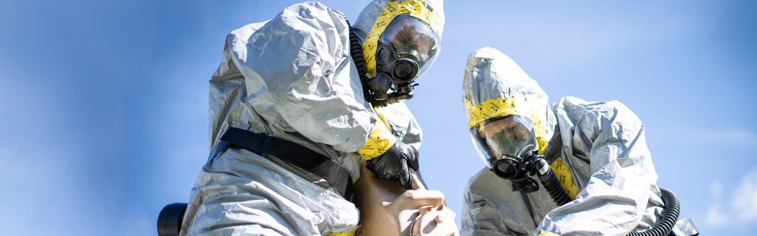 U.S. Marine Corps Staff Sgt. Albert Williams (left), and Staff Sgt. Pierce Draper, both explosive ordnance disposal technicians with Combat Logistics Battalion 11, 11th Marine Expeditionary Unit (MEU), pour bleach solution onto a simulated chemical weapon during chemical, biological, radiological and nuclear response training at Marine Corps Base Camp Pendleton, Calif., Jan. 22, 2020. The solution acts as a decontamination liquid, used to cleanse toxic chemicals from clothing, sites and ordnance. (U.S. Marine Corps photo by Cpl. Dalton S. Swanbeck) Cropped version of VIRIN 200122-M-EC058-1367