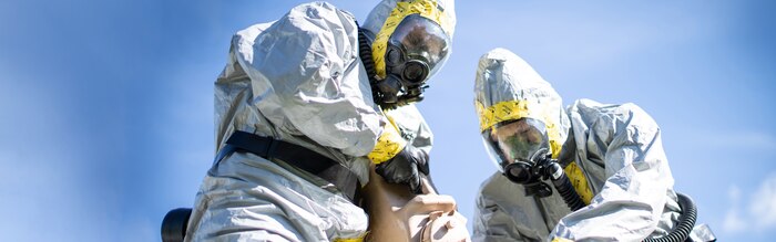 U.S. Marine Corps Staff Sgt. Albert Williams (left), and Staff Sgt. Pierce Draper, both explosive ordnance disposal technicians with Combat Logistics Battalion 11, 11th Marine Expeditionary Unit (MEU), pour bleach solution onto a simulated chemical weapon during chemical, biological, radiological and nuclear response training at Marine Corps Base Camp Pendleton, Calif., Jan. 22, 2020. The solution acts as a decontamination liquid, used to cleanse toxic chemicals from clothing, sites and ordnance. (U.S. Marine Corps photo by Cpl. Dalton S. Swanbeck) Cropped version of VIRIN 200122-M-EC058-1367