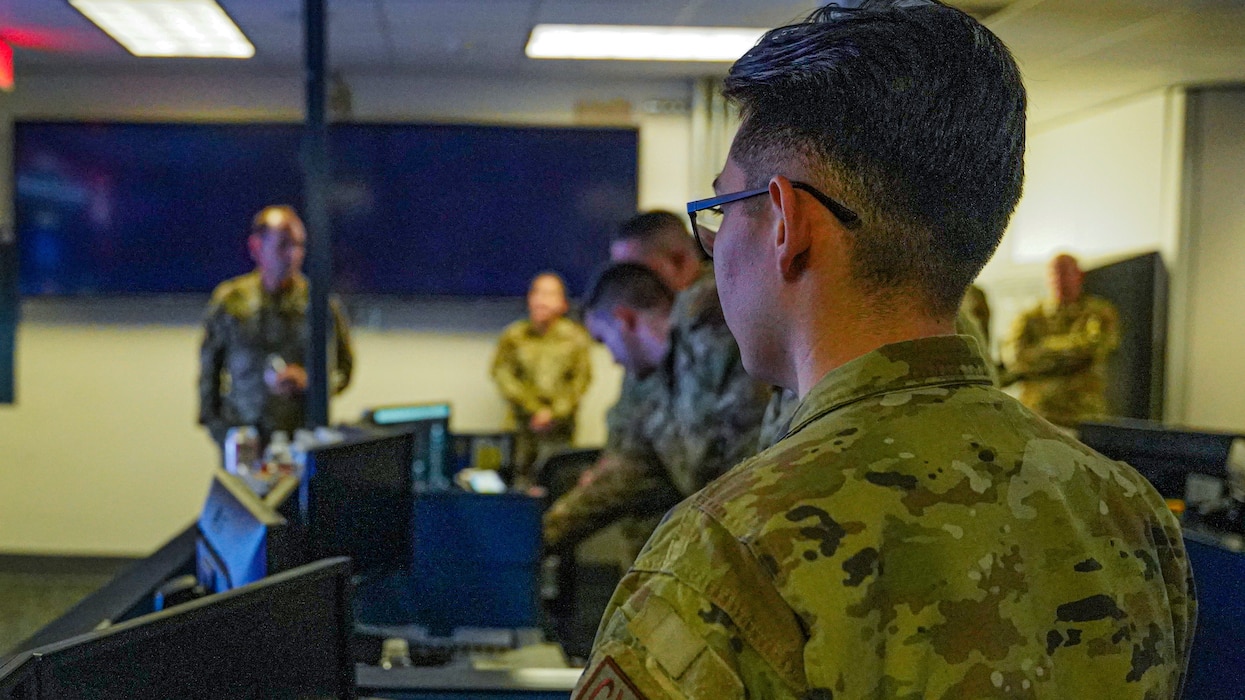 16th Air Force Command team receive a brief from 690th Cyberspace Control Squadron Airmen on the Air Force Mission Assurance Center operations floor Sept. 8, 2022 at Port San Antonio, Texas.