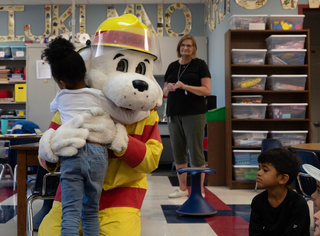 633d Civil Engineer Squadron firefighters from Joint base Langley-Eustis and Sparky the Fire Safety Dog visit Bethel Manor Elementary School as part of Fire Prevention Week.