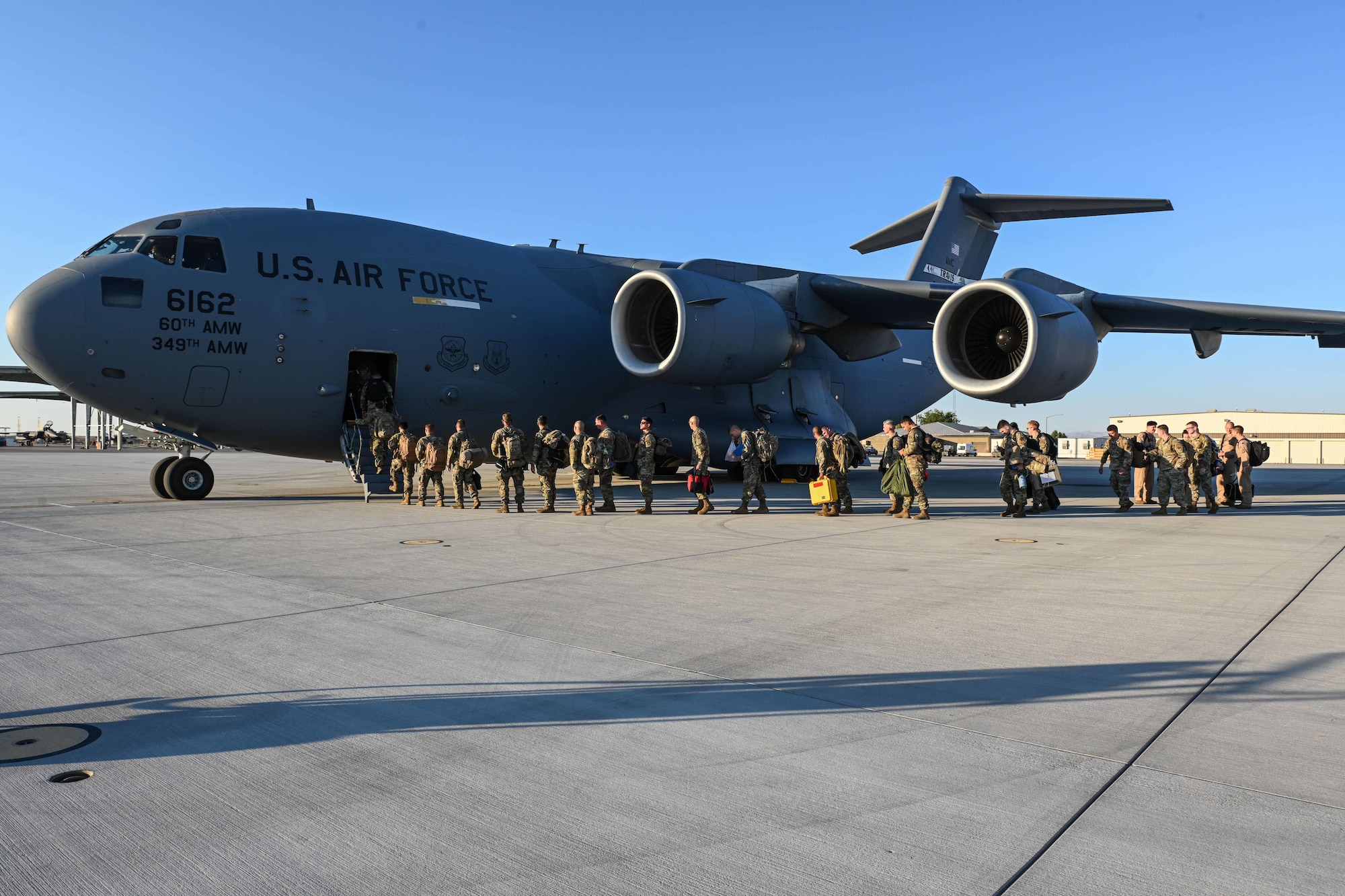 Airmen board a C-17 aircraft