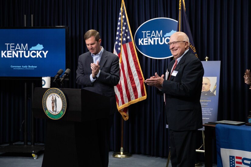 Kentucky Governor Andy Beshear (left) and Philip Miller, Kentucky chairman of the Employer Support of the Guard and Reserve(ESGR) introduce recipients of the Secretary of Defense Freedom Award at the Kentucky State Capitol in Frankfort, Ky. on Sept. 29, 2022. The Freedom Award is given to civilian employers of the Guard and Reserves by the ESGR for exceptional commitment to servicemembers' military careers. (U.S. Army photo by Andy Dickson)