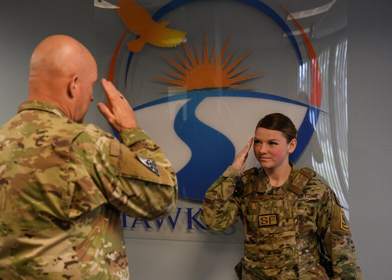 Senior Airman Kaitlyn Castro, 30th Security Forces Squadron patrolman, salutes U.S. Space Force Gen. John W. “Jay” Raymond, Chief of Space Operations, after receiving his coin at the Hawk’s Cove on Vandenberg Space Force Base, Calif., Oct. 11, 2022. Raymond visited the Hawk’s Cove for the first time since it was created, where it is first to combine all the military and civilian helping agencies, such as Equal Opportunity and the Sexual Assault Response coordinator’s office, into one centralized location. (U.S. Space Force photo by Airman 1st Class Ryan Quijas)
